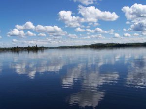 Lake-with-a-blue-sky-and-a-few-white-clouds.