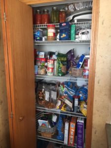 Pantry with door open.