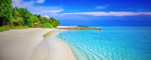 Beautiful white sandy beach turquoise and blue water.